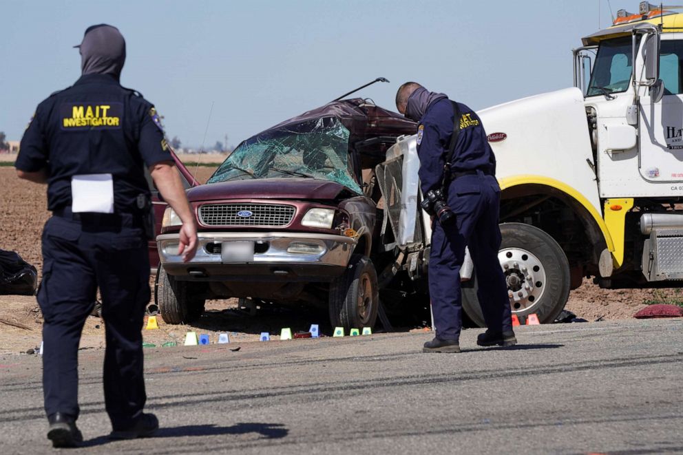 PHOTO: Members of the Multidisciplinary Accident Investigation Teams (MAIT) inspect the scene of a collision between a sport utility vehicle (SUV) and a tractor-trailer truck near Holtville, Calif., March 2, 2021.