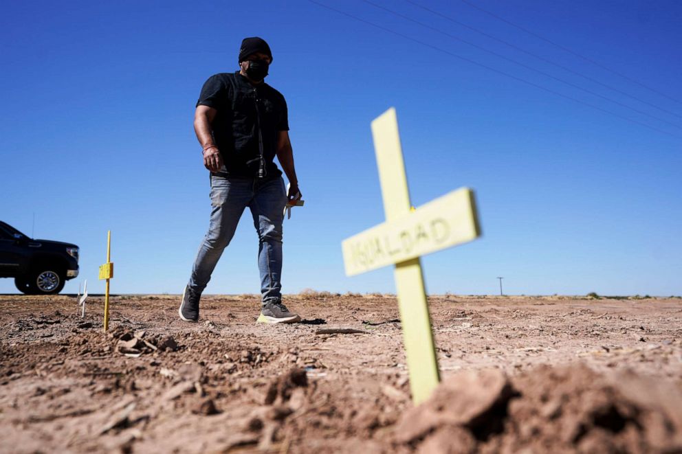 PHOTO: Hugo Castro leaves crosses at the scene of a deadly crash in Holtville, Calif., March 2, 2021.