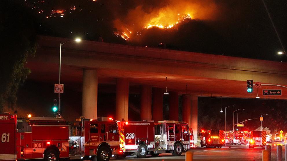PHOTO: Apparatus sits on Sepulveda Blvd. as fire burns along Interstate 405, Jan. 23, 2025, in Los Angeles. 
