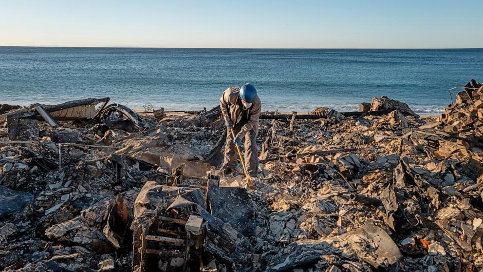 PHOTO: Patrick O'Neal sifts through his home after it was destroyed by the Palisades wildfire, Jan. 13, 2025, in Malibu, Calif. 