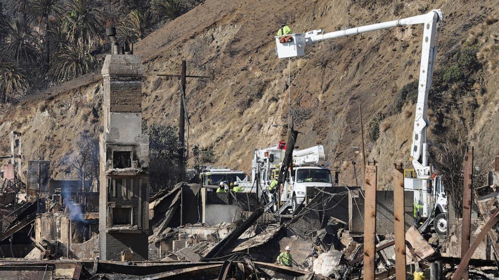 PHOTO: Workers replace power line following the Palisades Fire along Pacific coast in Malibu, Calif., Jan. 13, 2025. 