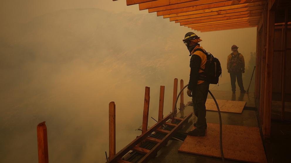 PHOTO: Firefighters monitor the advance of the Palisades Fire in Mandeville Canyon, Jan. 11, 2025, in Los Angeles.