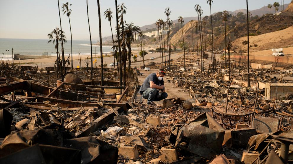 PHOTO: Kevin Marshall sifts through his mother's fire-ravaged property in the Palisades Fire in the Pacific Palisades neighborhood of Los Angeles, Jan. 11, 2025.