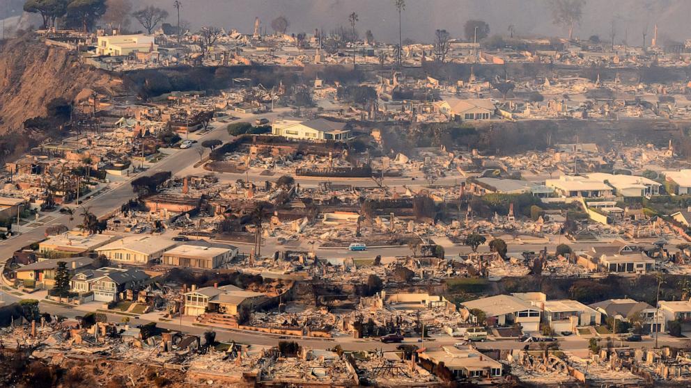 PHOTO: In this aerial view taken from a helicopter, burned homes are seen from above during the Palisades fire near the Pacific Palisades neighborhood of Los Angeles, Calif., Jan. 9, 2025. 