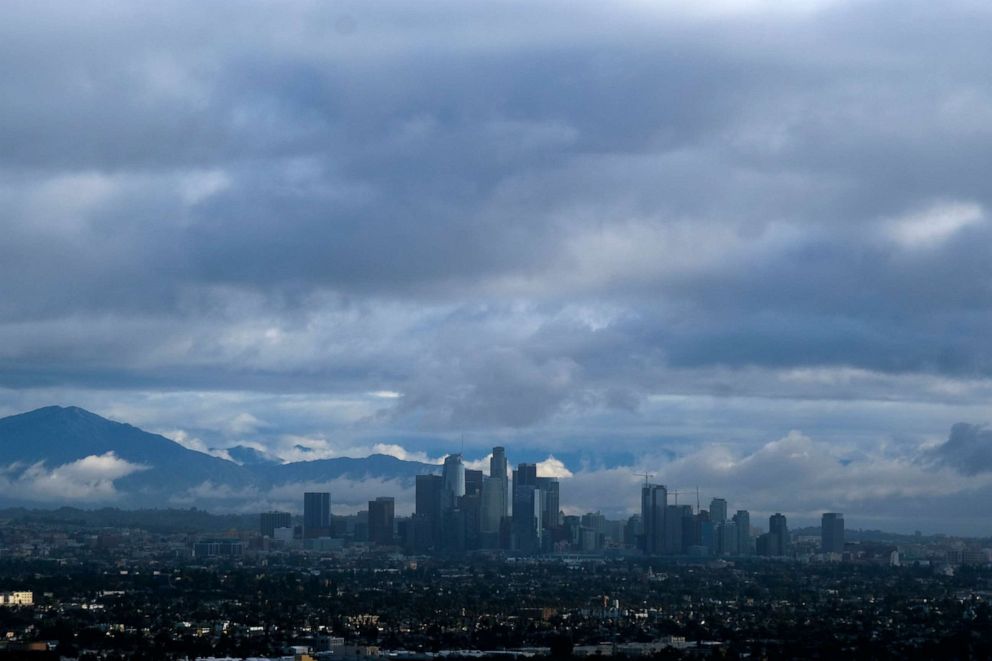 PHOTO: Storm clouds blanket the Los Angeles skyline is seen from Kenneth Hahn State Recreation Area, Dec. 24, 2021.