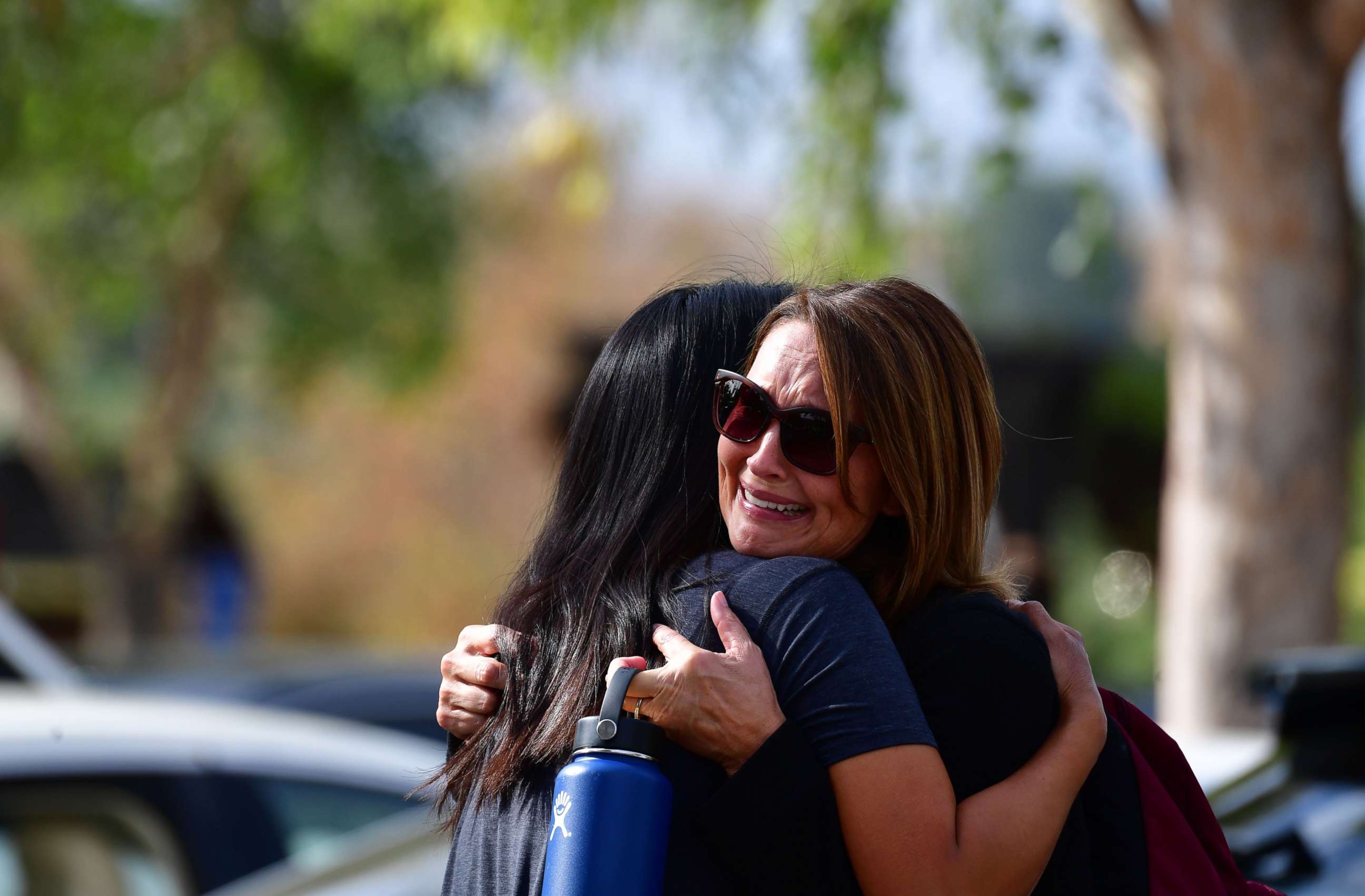 PHOTO: Women embrace in Central Park after a shooting at Saugus High School in Santa Clarita, California, Nov. 14, 2019.