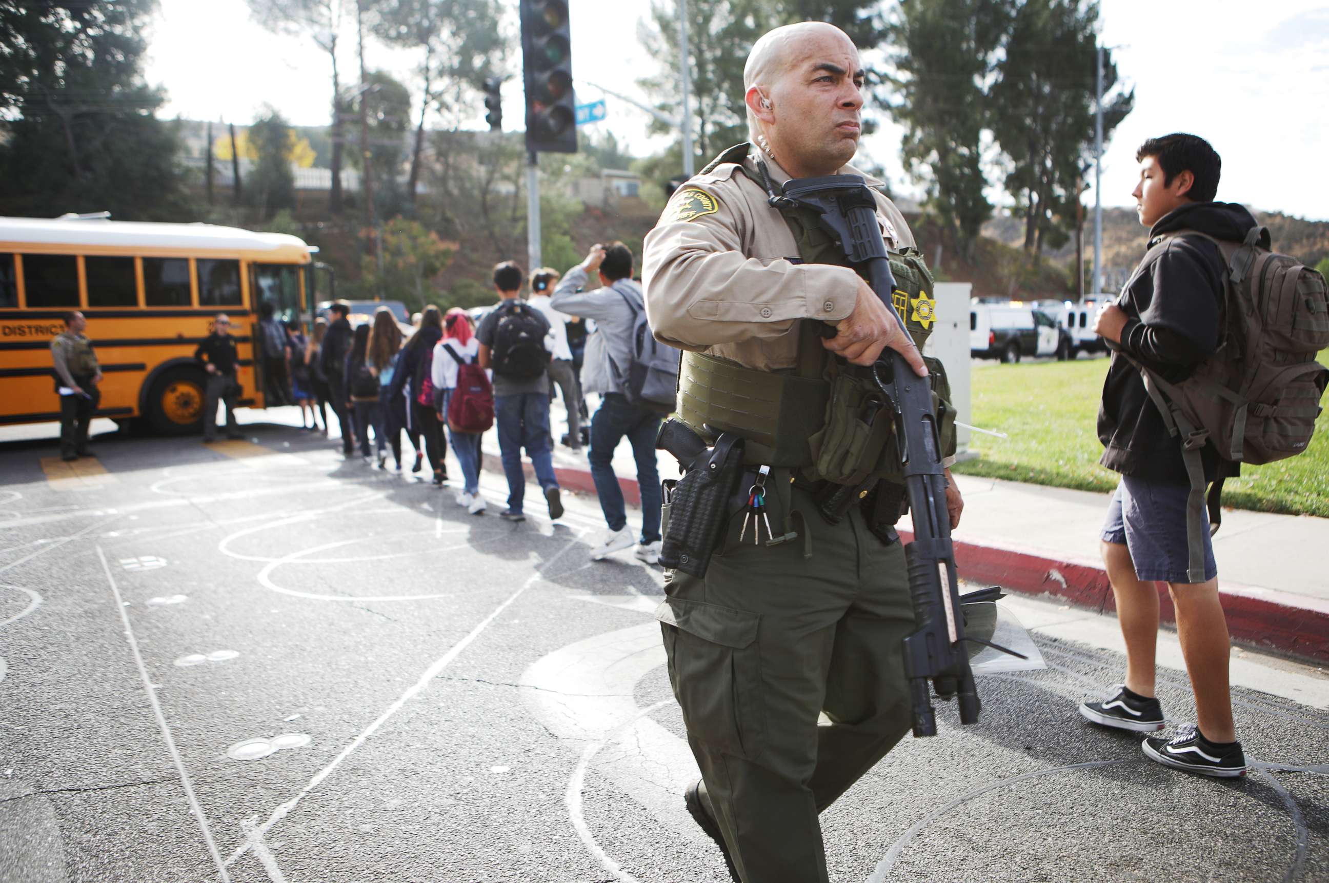 PHOTO: Students are evacuated from Saugus High School onto a school bus after a shooting at the school left two students dead and three wounded, Nov. 14, 2019, in Santa Clarita, California.