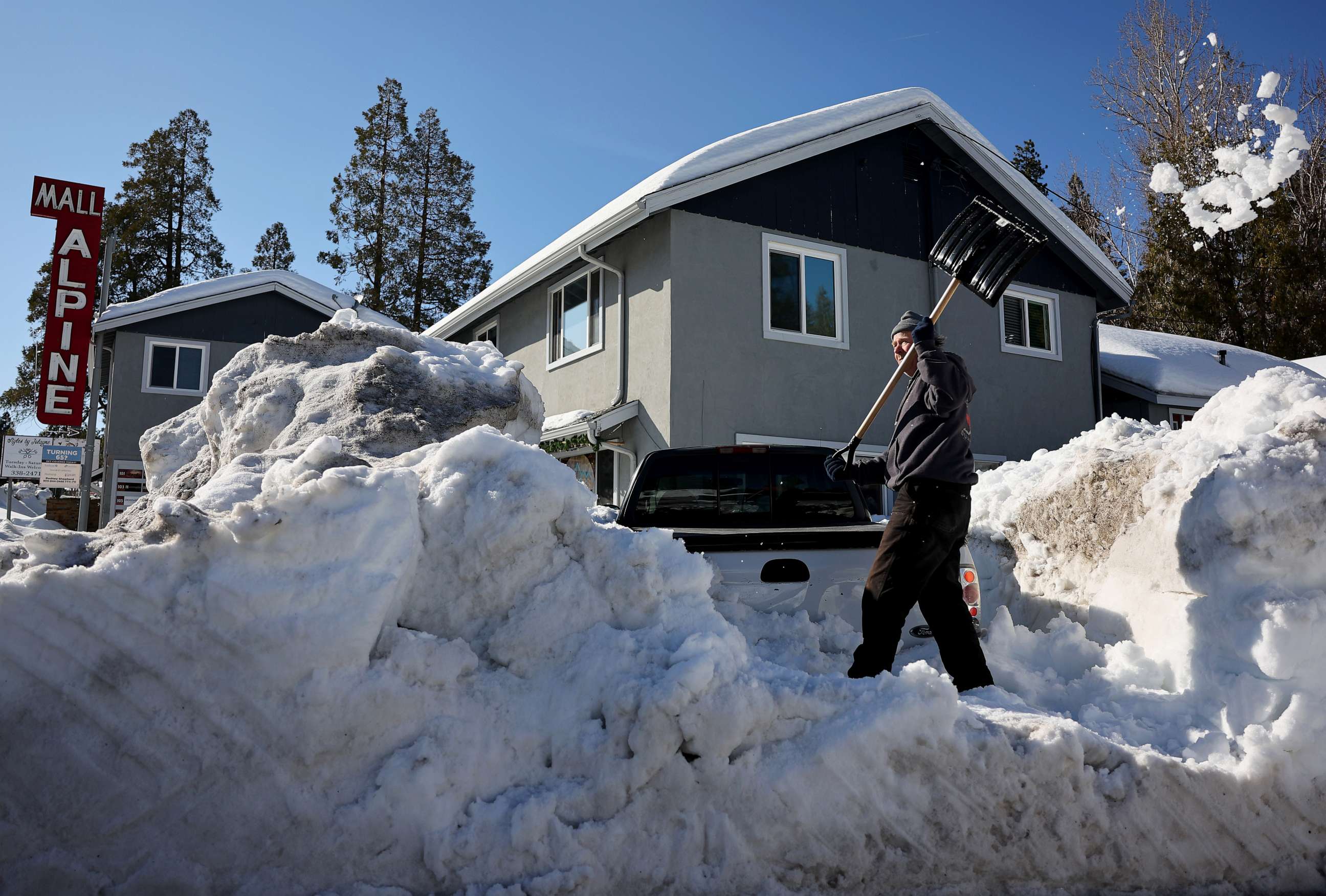 PHOTO: A resident shovels snow after a series of winter storms dumped heavy snowfall in the San Bernardino Mountains, Mar. 3, 2023 in Crestline, Calif.