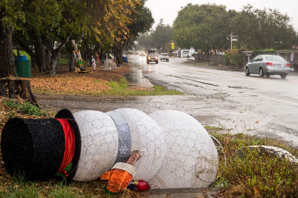 PHOTO: Christmas decorations are seen blown over by heavy winds in Carmel Valley, Calif., Dec. 13, 2021.