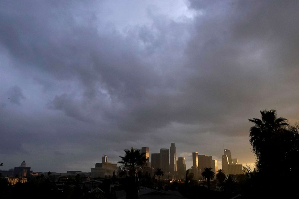 PHOTO: Heavy clouds move over downtown Los Angeles, Dec. 13, 2021.