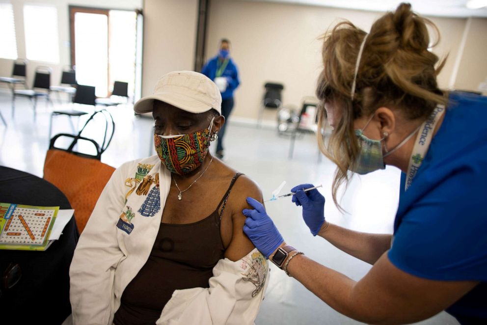 PHOTO: Lucille Douglas, 73, receives a second coronavirus disease (COVID-19) vaccination, in Los Angeles, March 12, 2021.
