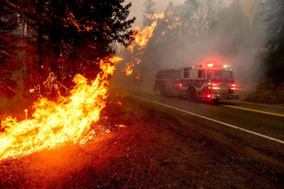 PHOTO: A firetruck drives along state Highway 168 while battling the Creek Fire in the Shaver Lake community of Fresno County, Calif., Sept. 7, 2020.