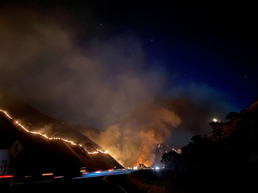 PHOTO: The Shell Fire burns vegetation on a hill along a highway in Kern County, Calif., June 27, 2021.