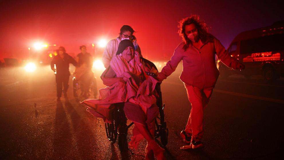 PHOTO: Residents of a senior center are evacuated as the Eaton Fire approaches, Jan. 7, 2025, in Altadena, Calif.