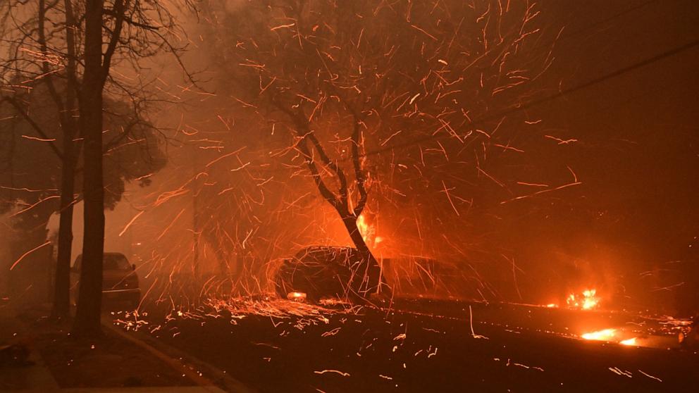 PHOTO: Embers from the Eaton Fire fly down a residential street in Altadena, Calif., on Jan. 8, 2025.