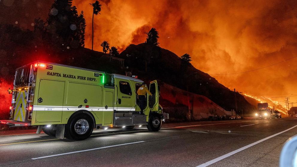 PHOTO: Santa Maria Fire truck speeds towards the fire as seen from the PCH (Pacific Coast Highway) in the town of Pacific Palisades, on the edge of Malibu, Calif., on Jan. 7, 2025.