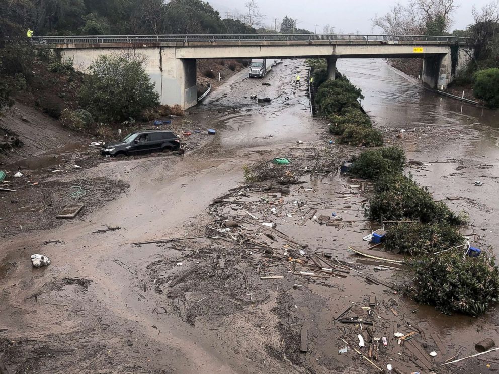 PHOTO: US 101 Freeway at the Olive Mill Road overpass flooded with runoff water from Montecito Creek and blocked with mudflow and debris following heavy rains in Montecito, Calif., Jan. 9, 2018. 