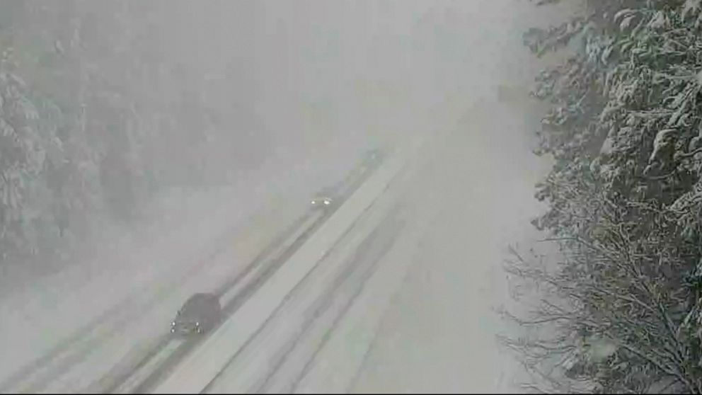 PHOTO: In this image from a Caltrans remote traffic video camera traffic makes its way through the snowy conditions on Highway 50 at Pollock Pines, Calif., Feb. 27, 2023.