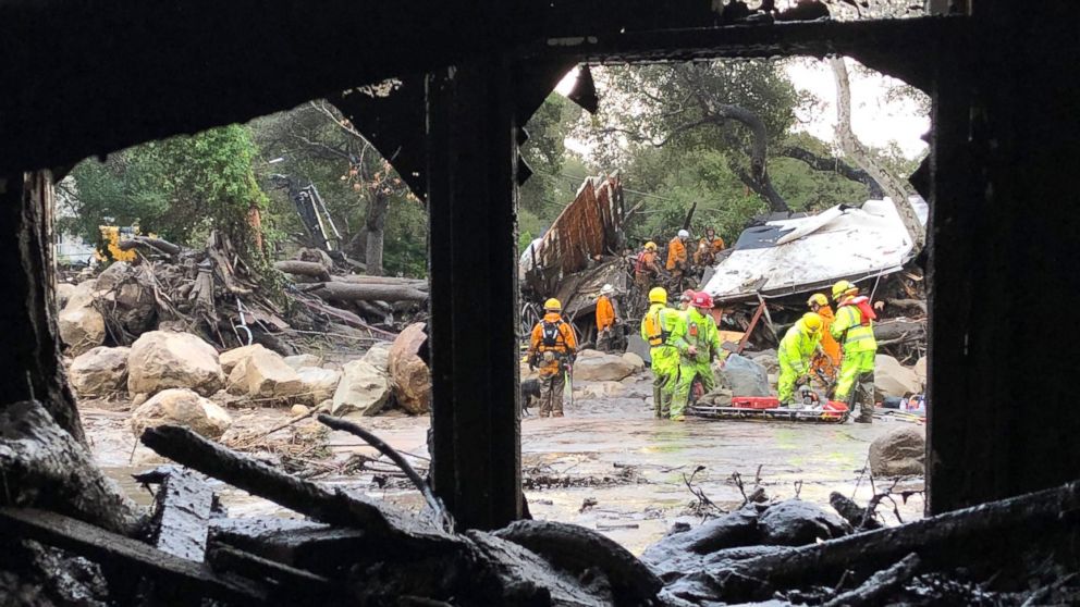 PHOTO: Firefighters search for trapped people in Montecito, Calif, Jan. 9, 2018, after mud and debris destroyed buildings following heavy rains. 