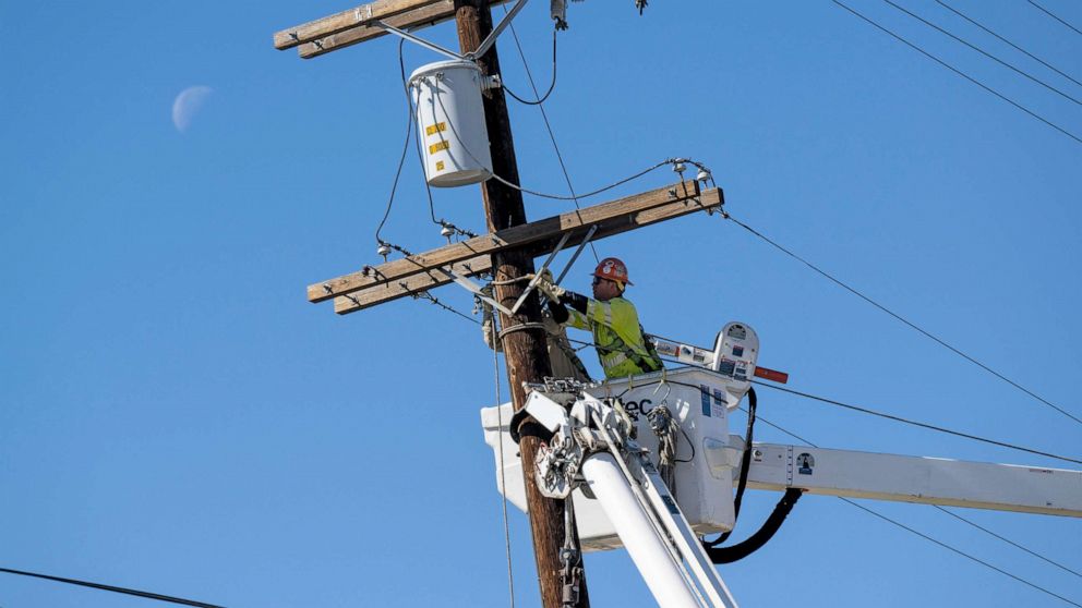 PHOTO: LA DWP crew members work on a high tension power pole that snapped at the base possibly due to high winds in Sylmar, Calif., Nov 16, 2022.