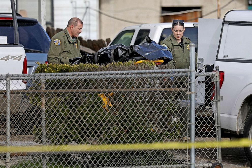 PHOTO: Tulare County Sheriff crime unit removes the body of one of the victims at the scene where six people were killed in a Central Valley farming community, Jan. 16, 2023, in Goshen, Calif.