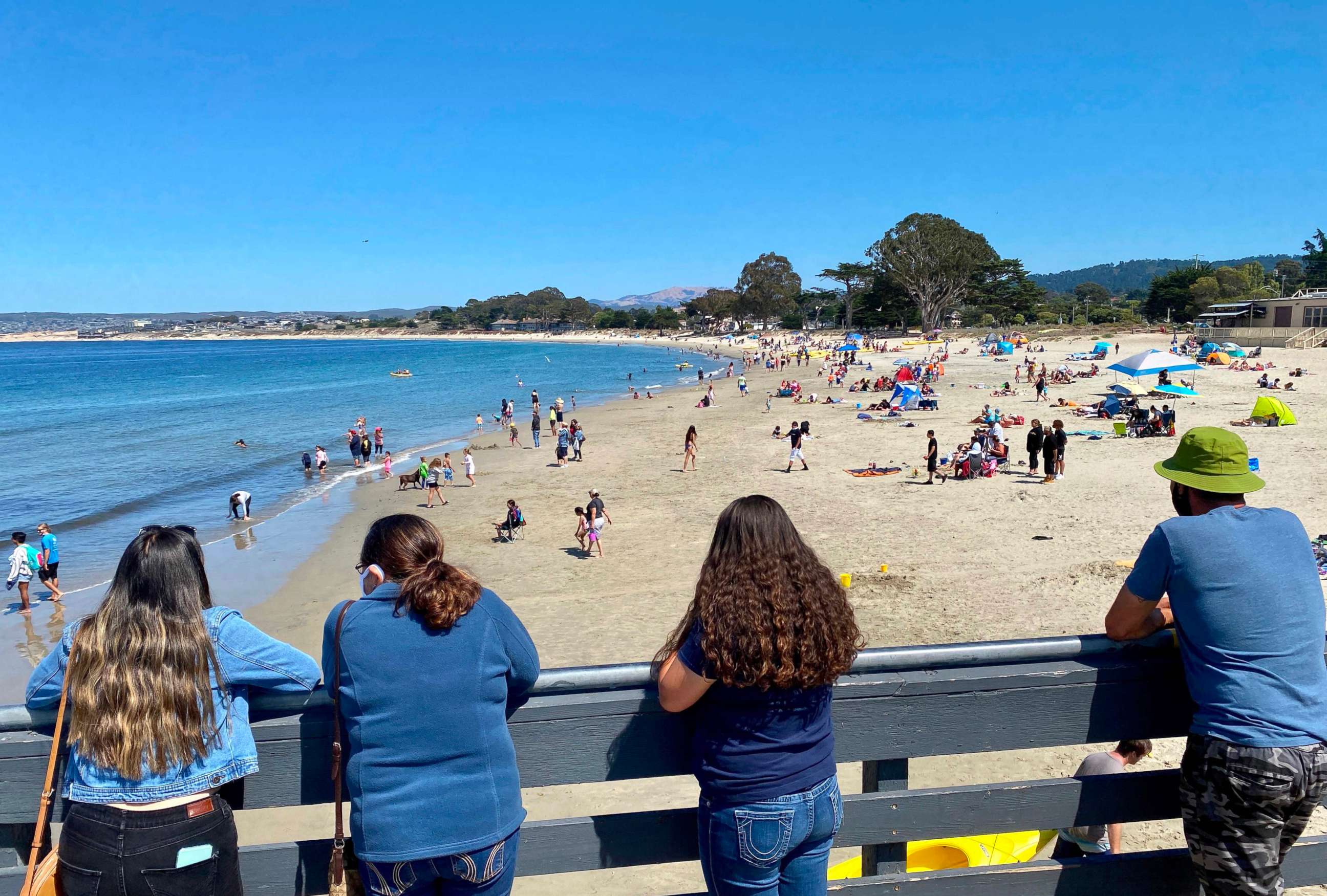 PHOTO: Sunbathers enjoy the Fisherman's Warf beach in Monterey, California, Aug. 1, 2020, amid the Coronavirus outbreak. 