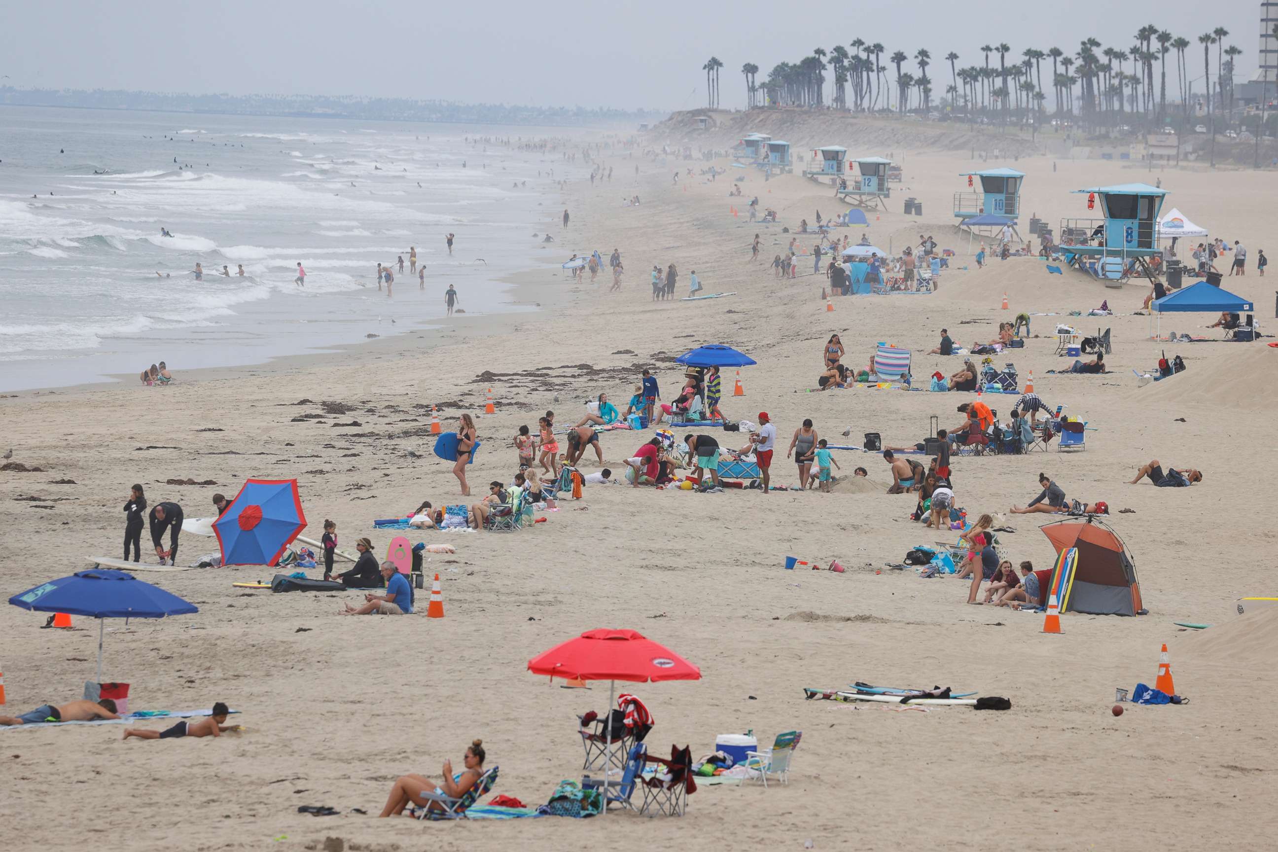 PHOTO: People enjoy the beach during the global outbreak of COVID-19, in Huntington Beach, Calif., July 23, 2020.