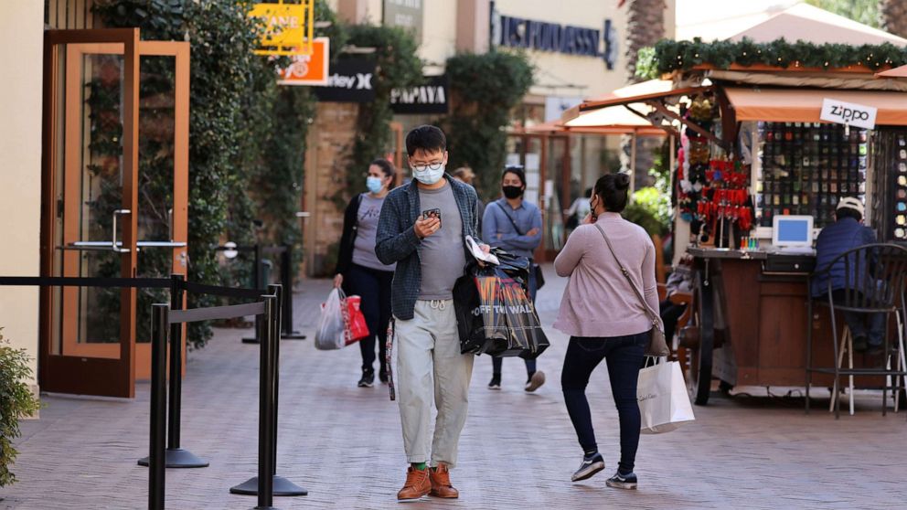 PHOTO: People shop at the Citadel Outlet mall, as the global outbreak of the COVID-19 continues, in Commerce, Calif., Dec. 3, 2020.