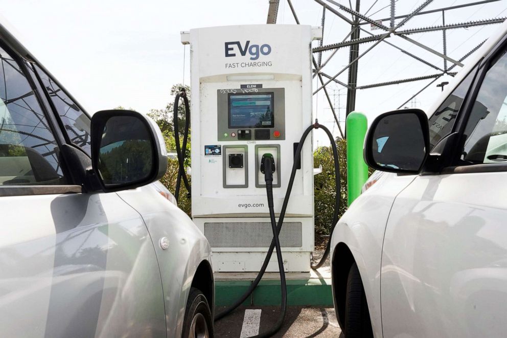 PHOTO: Electric cars are parked at a charging station in Sacramento, Calif., on April 13, 2022. California wants electric vehicle sales to triple in the next four years to 35% of all new car purchases. 