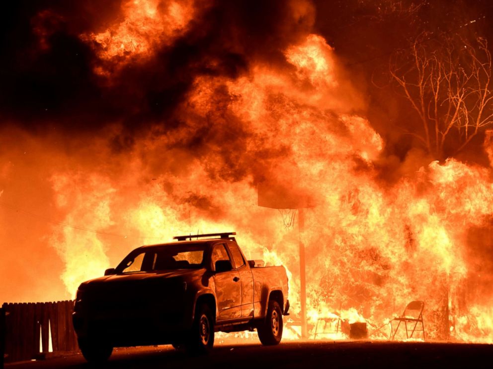 PHOTO: Flames spread behind a vehicle from a Santa Ana wind-driven brush fire called the Thomas Fire in Santa Paula, Calif., Dec. 4, 2017.