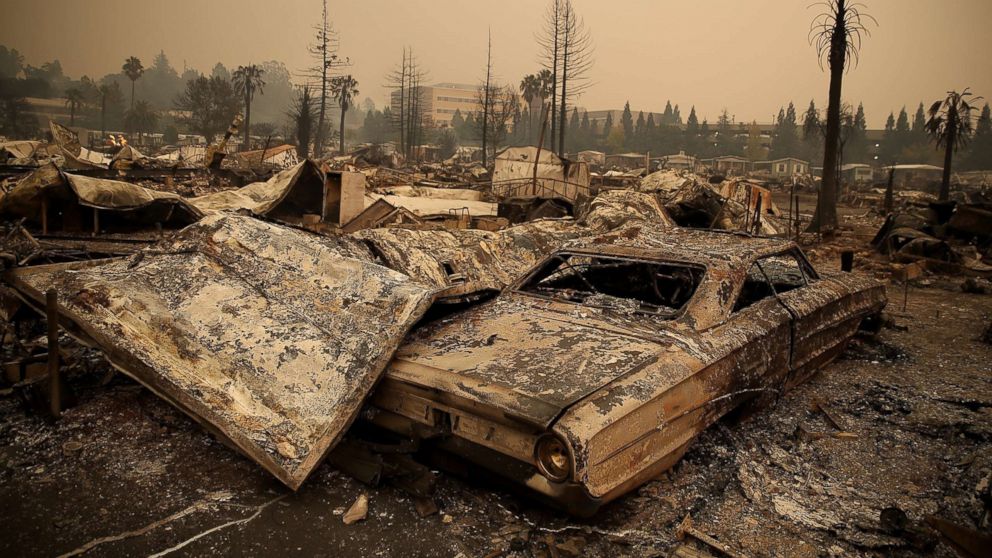 PHOTO: The remains of a fire damaged homes and cars at the Journey's End Mobile Home Park, Oct. 9, 2017 in Santa Rosa, Calif. 