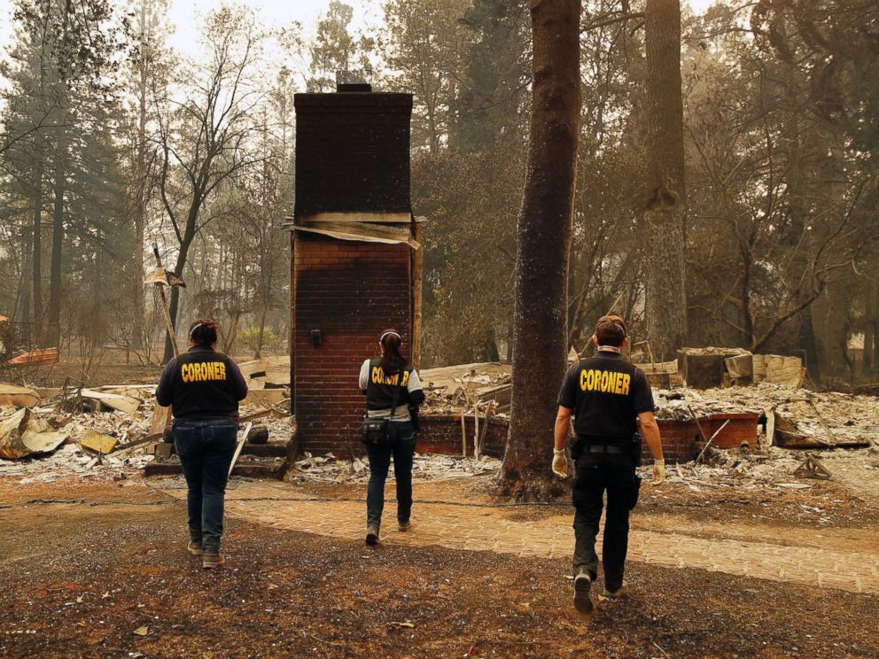 PHOTO: Members of the Sacramento County Coroners office look for human remains in the rubble of a house burned at the Camp Fire, Nov. 12, 2018, in Paradise, Calif.