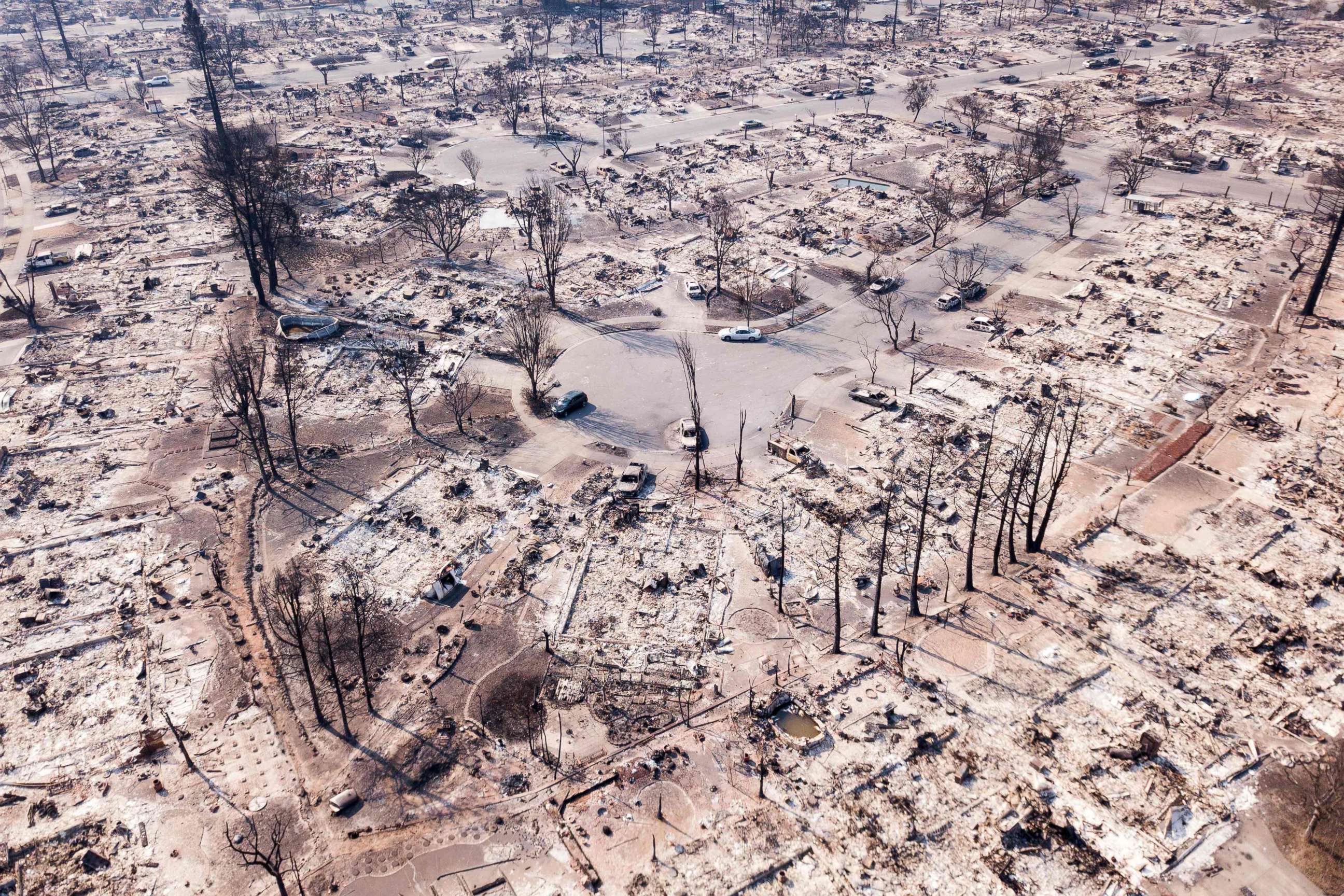 PHOTO: Fire damage is seen from the air in the Coffey Park neighborhood in Santa Rosa, Calif, Oct. 11, 2017. More than 200 fire engines and firefighting crews from around the country were being rushed to California to help battle the fires.