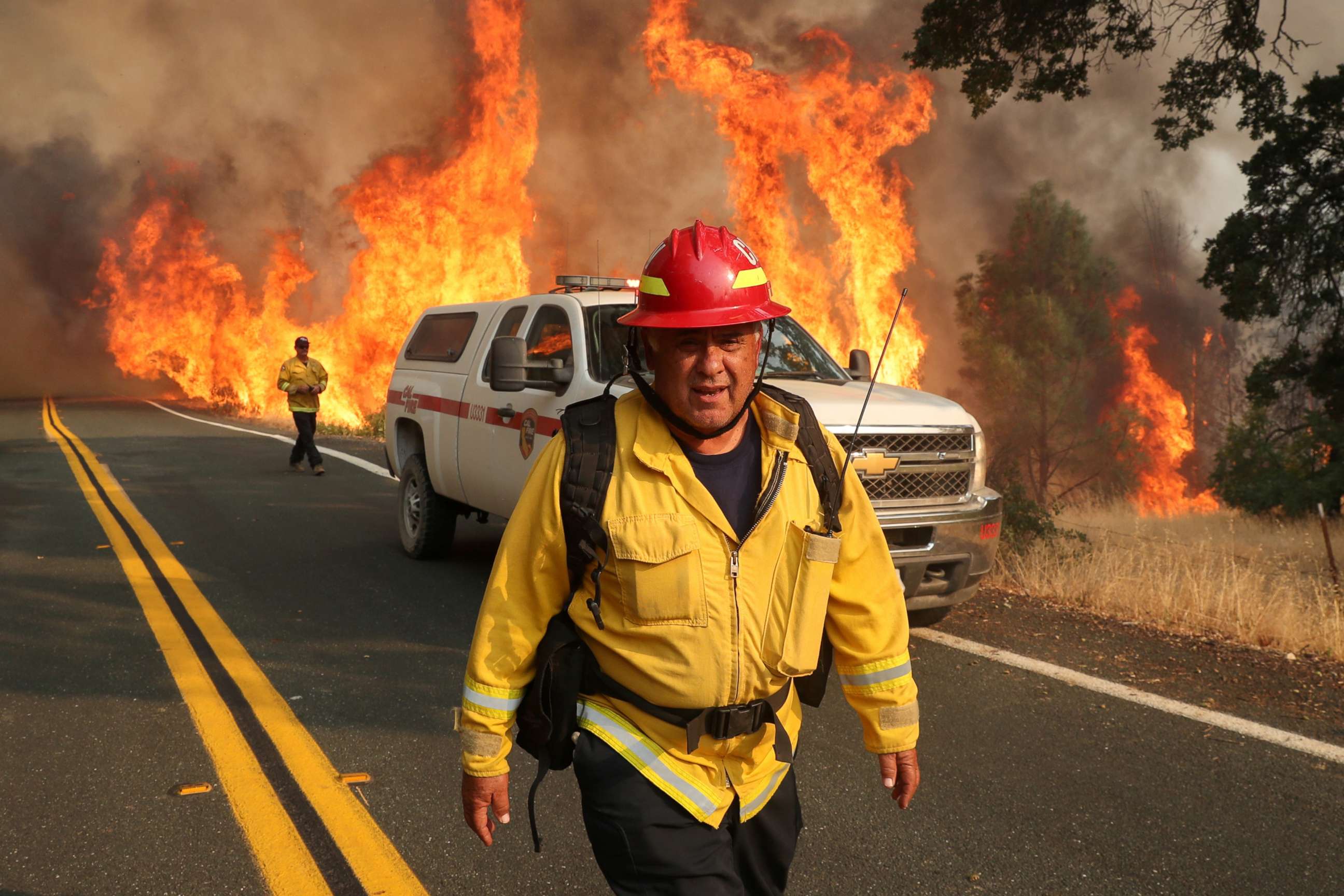PHOTO: Chula Vista firefighter Rudy Diaz monitors the LNU Lightning Complex Fire as it engulfs brush in Lake County, Calif., Aug. 23, 2020.