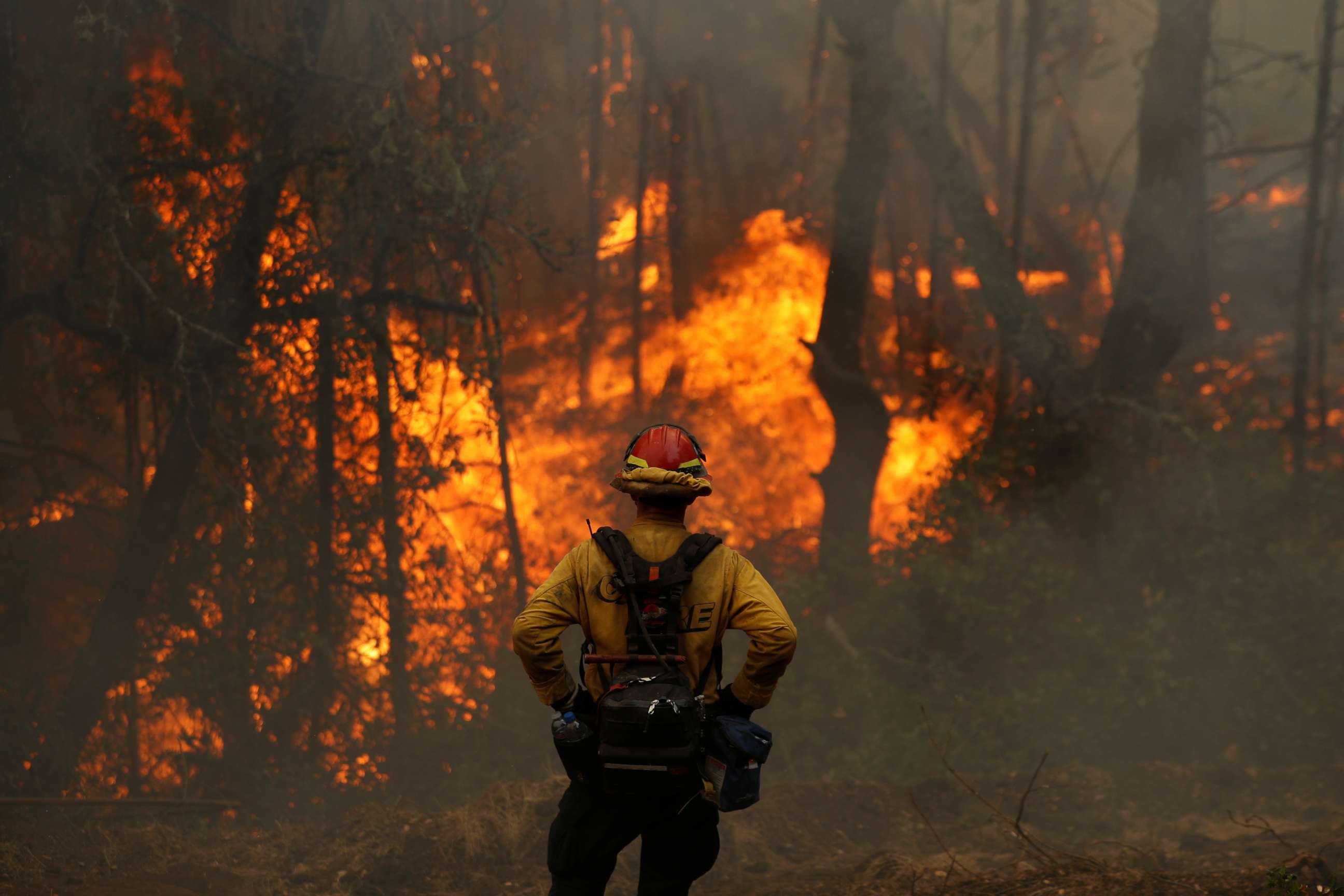 PHOTO: A Cal Fire firefighter monitors a firing operation while battling the Glass Fire in Calistoga, Calif., Oct. 2, 2020.