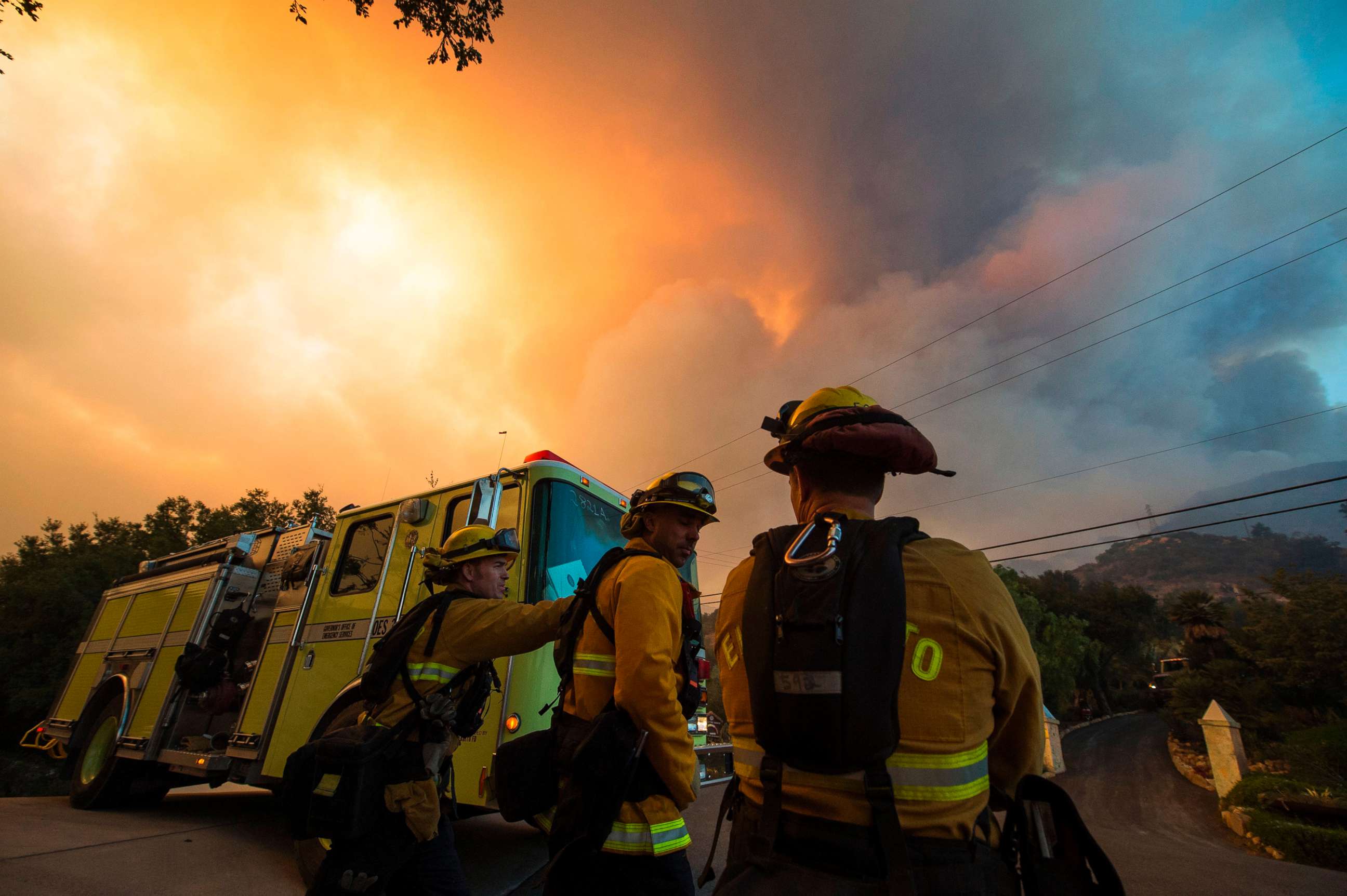 PHOTO: Firefighters from the Governors Office of Emergency Services monitor the advance of smoke and flames from the Thomas Fire, Dec. 16, 2017 in Montecito, Calif.