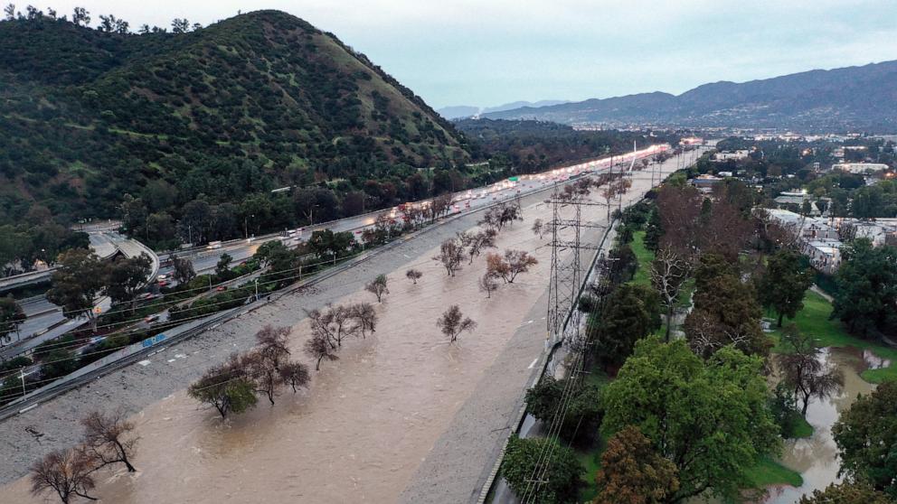 PHOTO: *An aerial view of the Los Angeles River swollen by storm runoff as a powerrful atmospheric river storm continues to impact southern California, Feb. 5, 2024, in Los Angeles.