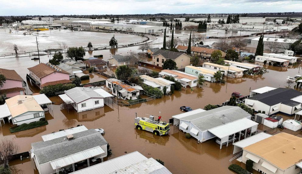 PHOTO: This aerial view shows rescue crews assisting stranded residents in a flooded neighborhood, Jan. 10, 2023, in Merced, Calif.
