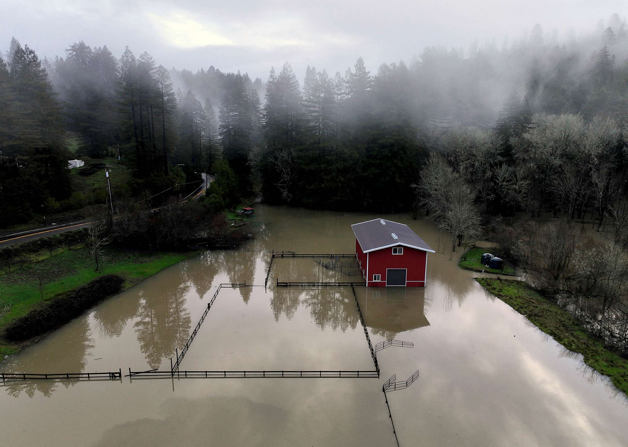 PHOTO: A building surrounded by floodwaters following a chain of winter storms is seen Jan. 15, 2023 in Guerneville, Calif.