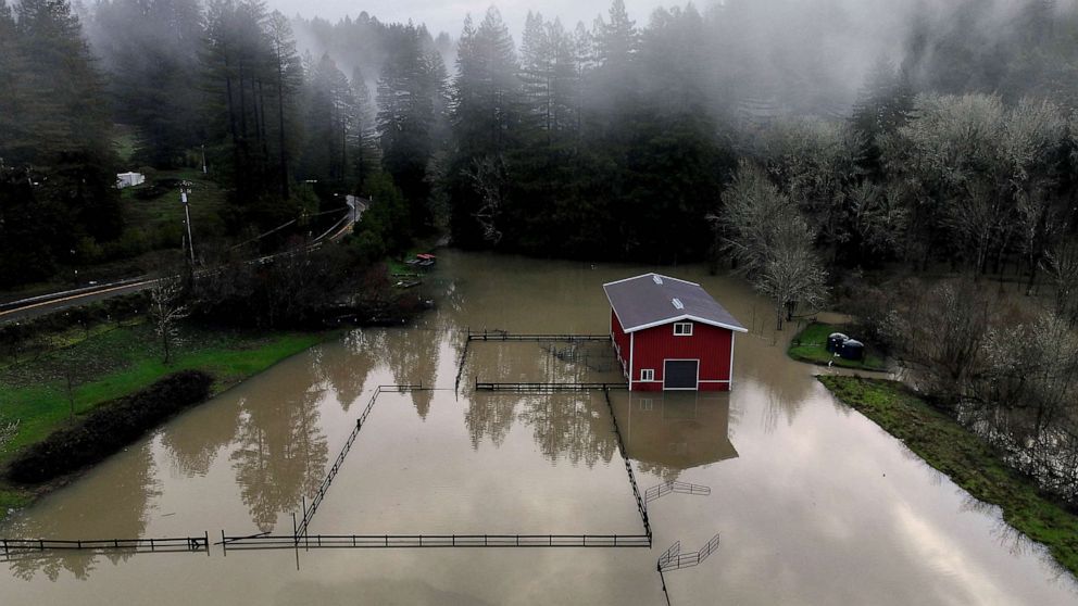 PHOTO: A building surrounded by floodwaters following a chain of winter storms is seen Jan. 15, 2023 in Guerneville, Calif.