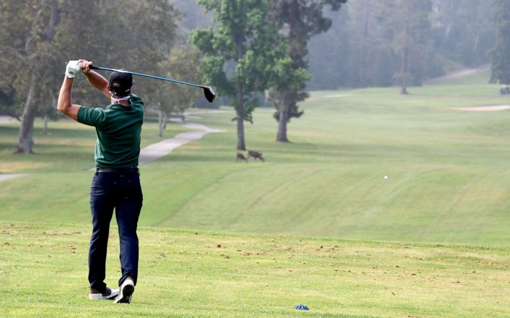 PHOTO: A golfer tees off at Wilson & Harding Golf Courses in Los Angeles, May 9, 2020.