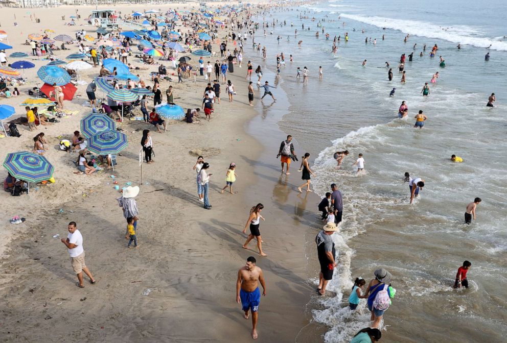 PHOTO: People gather along Santa Monica beach amid an intense heat wave in Southern California, on Sept. 4, 2022, in Santa Monica, Calif.