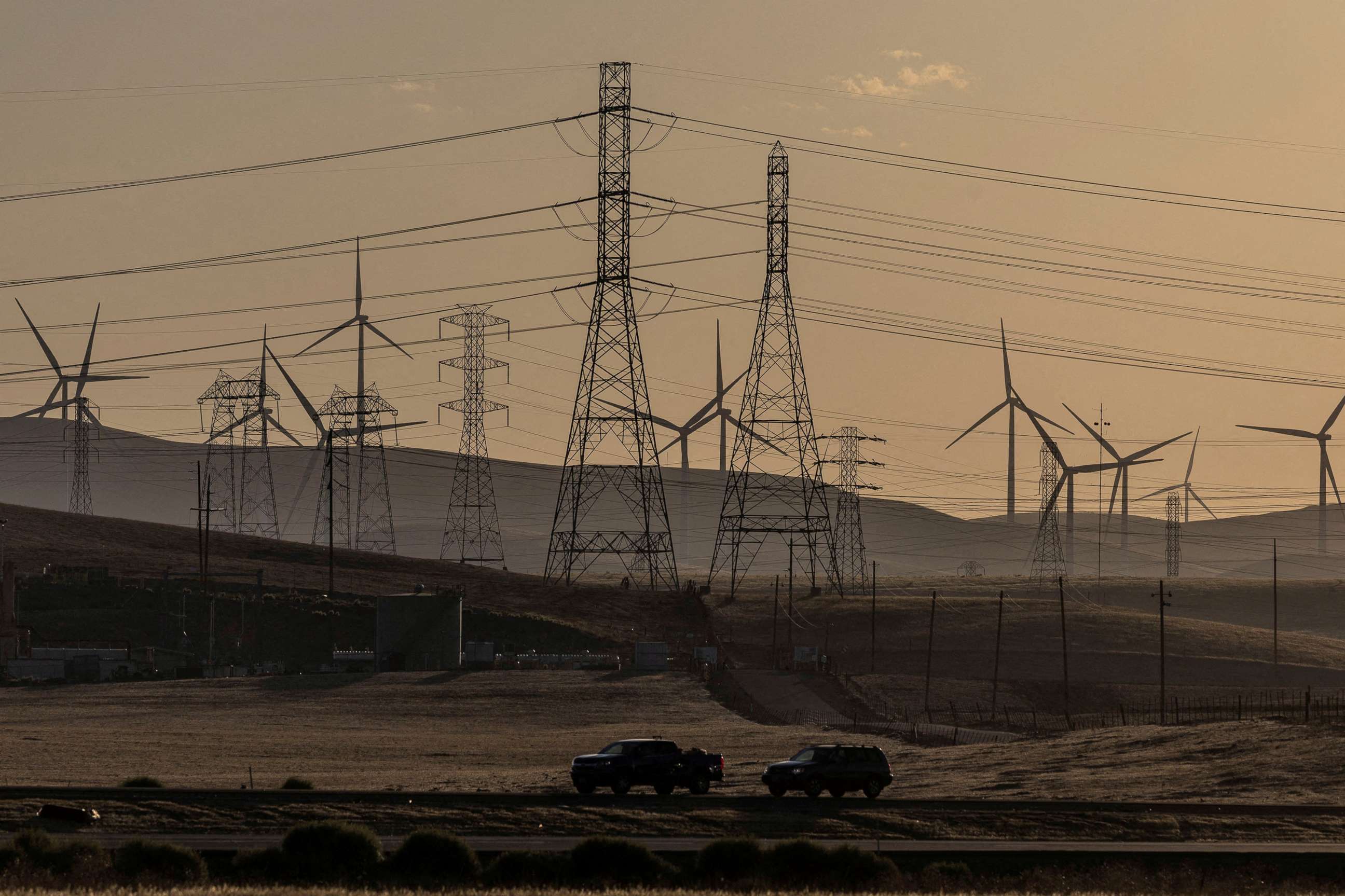 PHOTO: In this Aug. 17, 2022, file photo, windmills and power lines are shown near Tracy, Calif. 