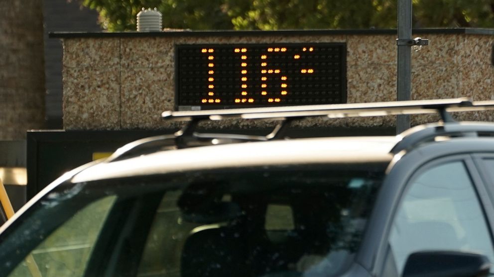 PHOTO: A vehicle passes a bank sign displaying a temperature of 116 degree in Sacramento, Calif., on Sept. 6, 2022.
