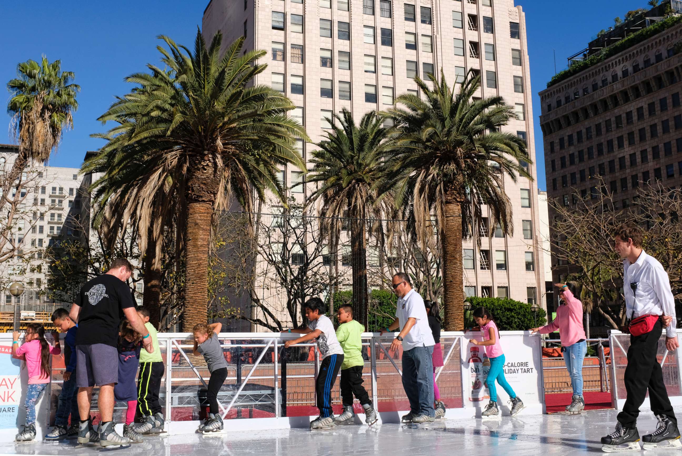 PHOTO: Schoolchildren carefully maneuver their way around the Holiday Ice Rink in Pershing Square in downtown Los Angeles on Nov. 22, 2017.