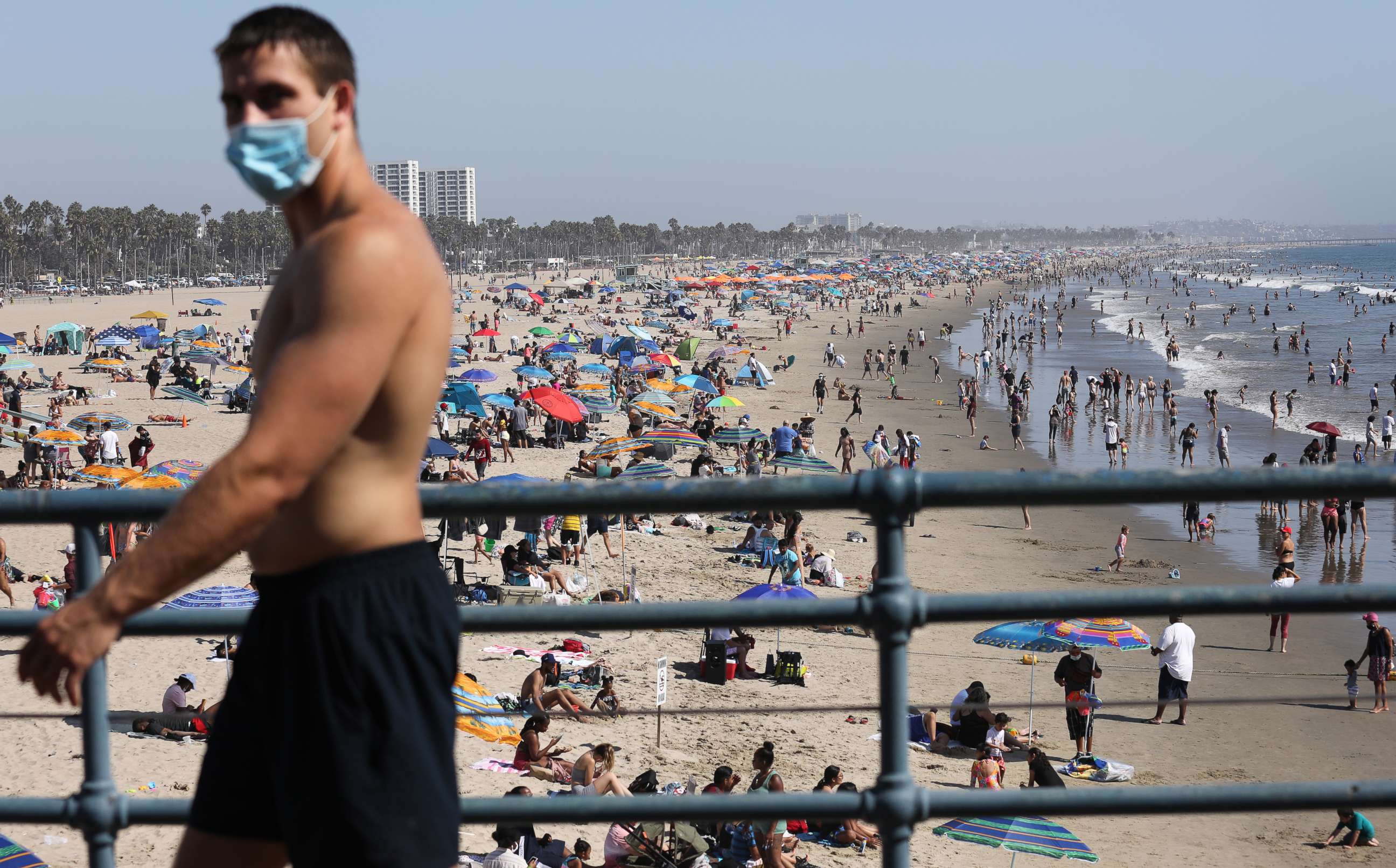 PHOTO: A man wears a face covering at the pier on the first day of the Labor Day weekend amid a heatwave on Sept. 5, 2020, in Santa Monica, Calif.