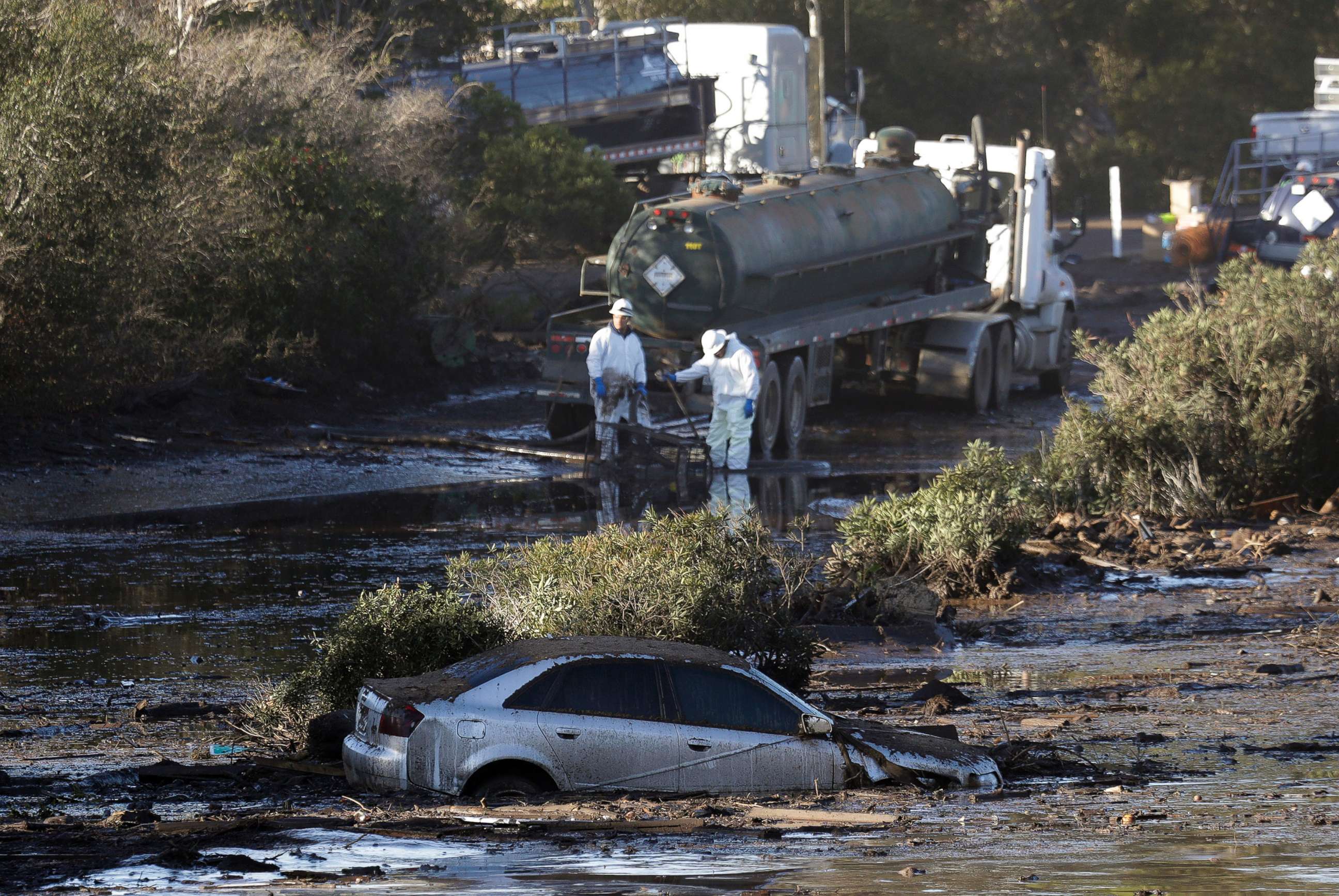 PHOTO: Crews pump mud on Highway 101 after a mudslide, Jan. 13, 2018, in Montecito, Calif.  