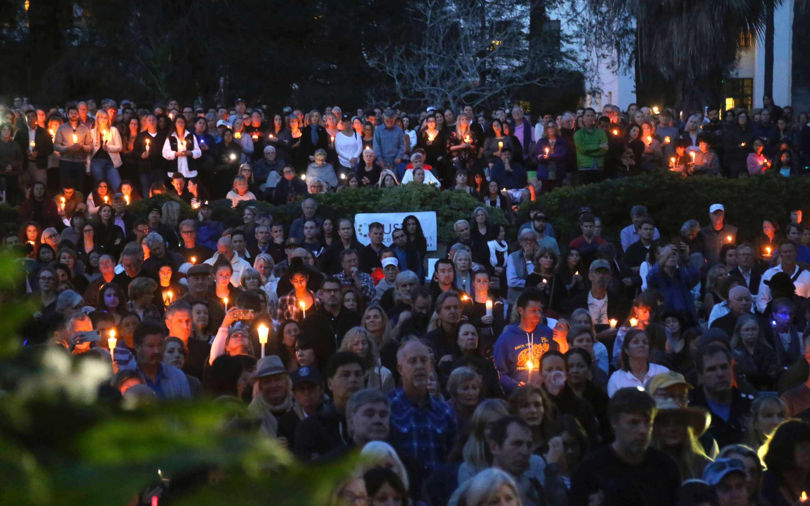 PHOTO: People attend a candlelight vigil in Santa Barbara, Calif., Jan. 14, 2018, to pay tribute to the people who were killed when mudslides ravaged a Southern California. 