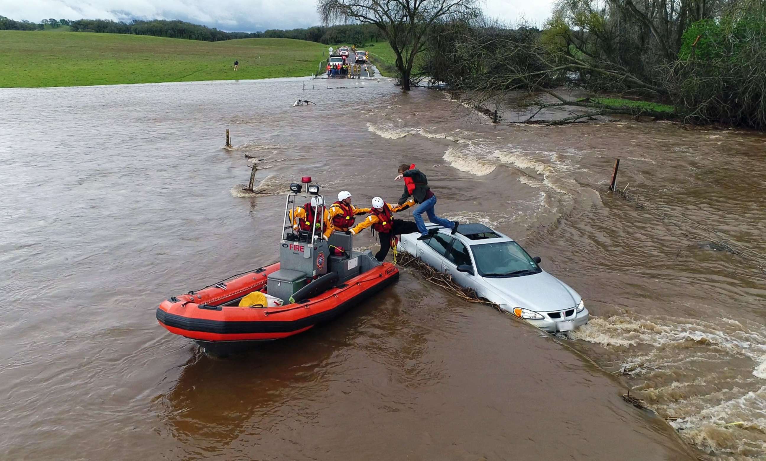 PHOTO: Firefighters from the Folsom, Calif., Fire Department rescued a motorist whose car became stuck as a flash flood washed over a road, March 22, 2018.
