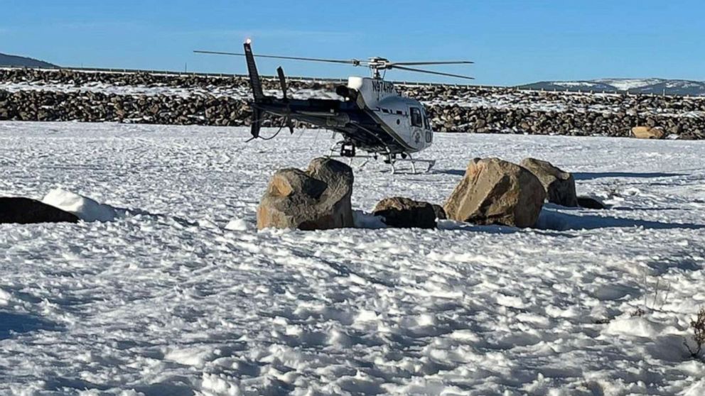 PHOTO: A rescue helicopter sits near the Stampede Meadows Reservoir as firefighters search for a person missing after falling through the ice near Truckee, Calif., on Feb. 5, 2022.